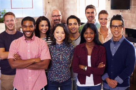 Portrait-Of-Staff-Standing-In-Modern-Design-Office.jpg