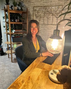 Dr. Bethany Bilodeau, founder of CORE Methods, seated in an educational workspace.